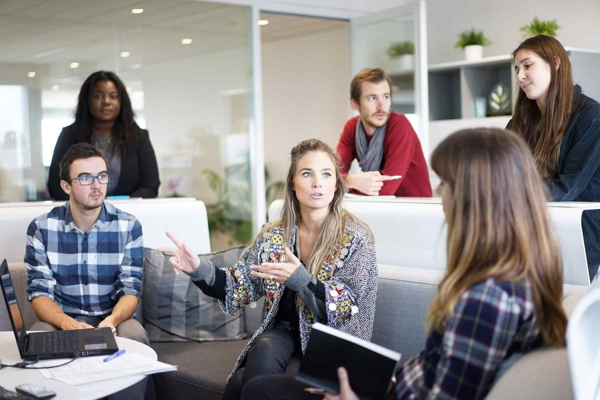 Team discussion in a modern office setting.