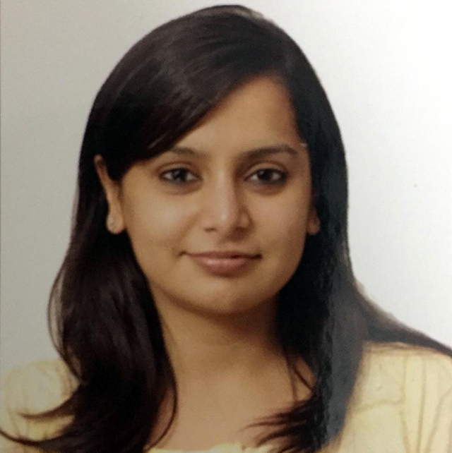 Portrait of a woman with dark hair.